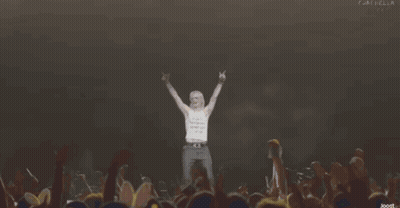 Man Stands In Front Of Crowd With Word Dios GIF