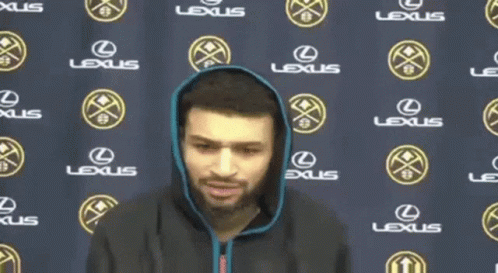 Man Stands In Front Of Lexus Banner GIF