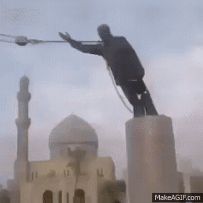 Man Statue On Pedestal With Mosque Background GIF