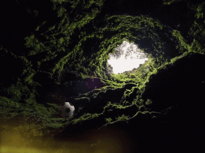 Man Statue Sitting At Table In Dark Cave GIF