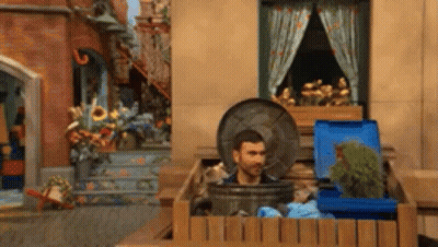 Man Sticking Head Out Of Trashcan GIF