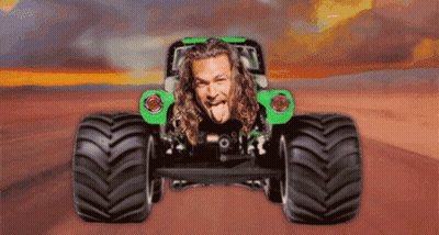 Man Sticking Out Tongue Driving Monster Truck GIF