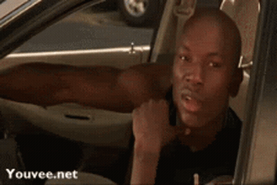 Man Sticking Tongue Out In Car GIF