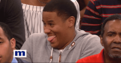 Man Sticking Tongue Out In Crowd GIF