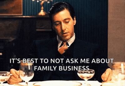 Man Suit And Tie Holding Wine And Plate GIF