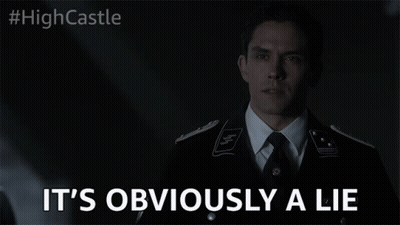 Man Suit Tie Eyes Closed Says Obviously Lie GIF