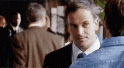 Man Suit Tie Talking To Woman Blue Shirt GIF