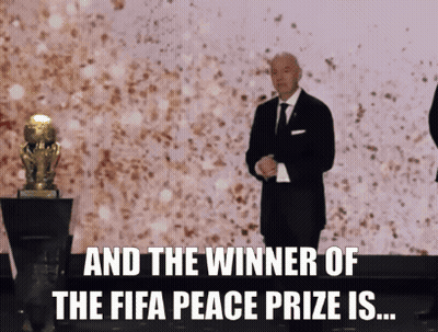 Man Suit Tie Trophy FIFA Peace Prize Winner GIF