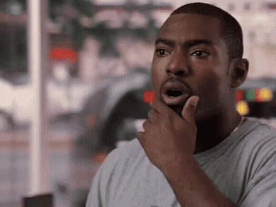 Man Surprised With Hand To Chin GIF