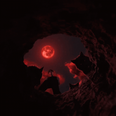 Man Surrounded By Three Black Wolves With Red Eyes GIF