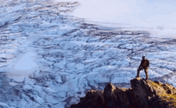 Man Surveying From The Top Of Mountain GIF