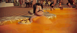 Man Swimming In Cheese Pool While Eating Nacho GIF