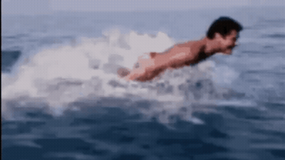 Man Swimming In Ocean Without Shirt GIF