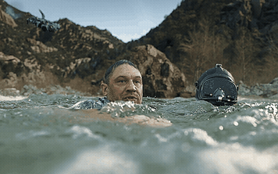 Man Swimming In Water With Helmet GIF