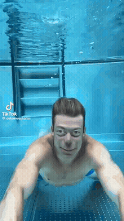 Man Swimming Underwater GIF