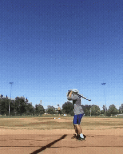 Man Swinging Baseball Bat On Field GIF