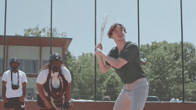 Man Swinging Bat While Catcher Watches GIF