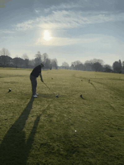Man Swinging Golf Club GIF