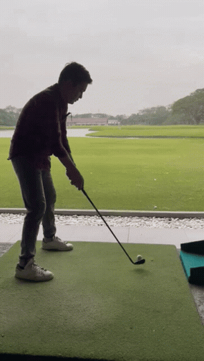 Man Swinging Golf Club GIF
