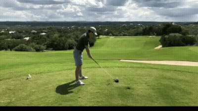 Man Swinging Golf Club At Golf Ball GIF