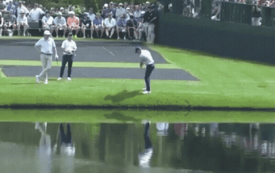 Man Swinging Golf Club GIF