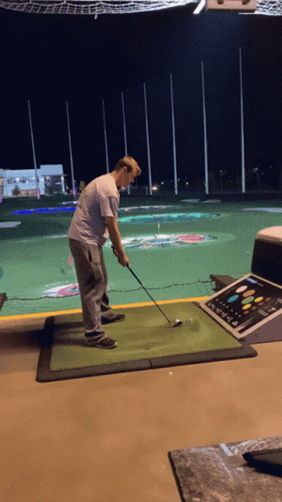 Man Swinging Golf Club GIF