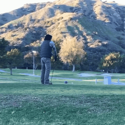 Man Swinging Golf Club GIF