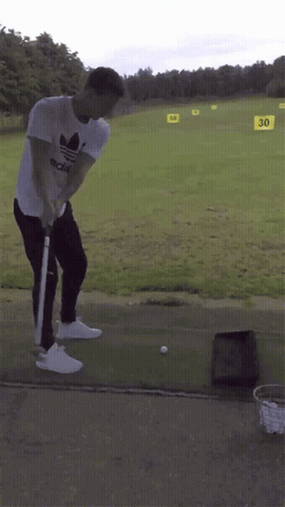 Man Swinging Golf Club With 30 Sign GIF