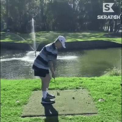 Man Swinging Golf Club With Fountain GIF