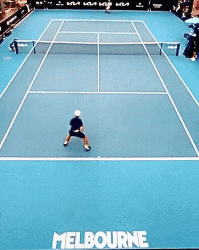 Man Swinging Tennis Racket With 1573 Sign GIF