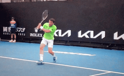 Man Swinging Tennis Racquet With Rolex Sign GIF