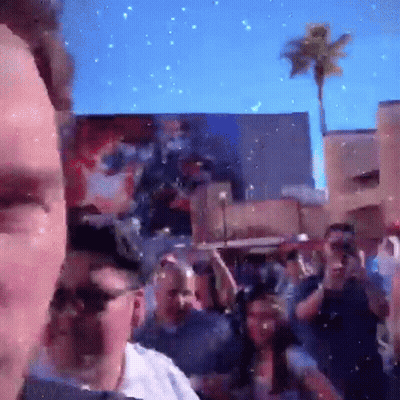 Man Taking Picture Of Crowd GIF