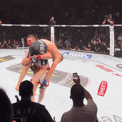 Man Taking Picture Of Fighter With Mirai Shirt GIF