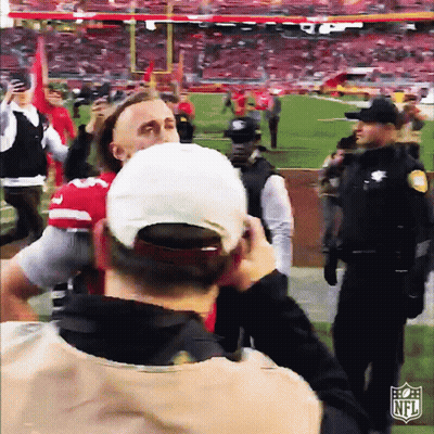 Man Taking Picture Of Football Game With NFL Logo GIF