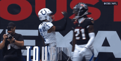 Man Taking Picture Of Football Player Number 21 GIF
