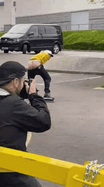 Man Taking Picture Of Man On Skateboard GIF