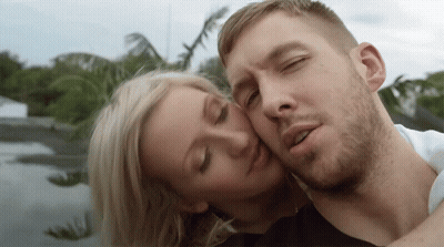 Man Taking Picture Of Woman On Bed GIF