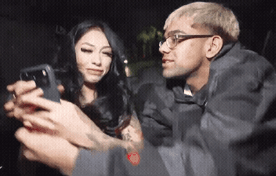 Man Taking Picture Of Woman With Phone GIF