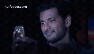 Man Taking Selfie In Dark Room GIF