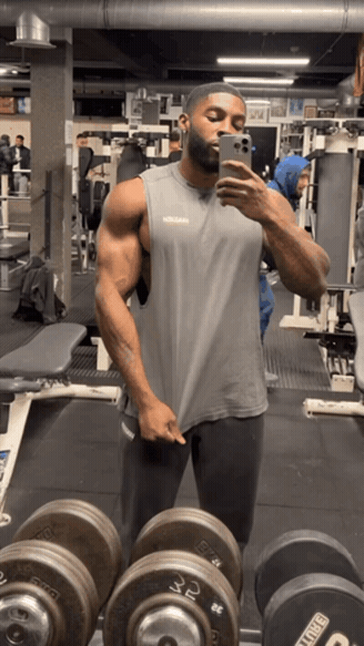Man Taking Selfie In Gym With King Dumbbells GIF