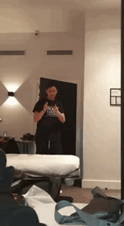 Man Taking Selfie In Hotel Mirror GIF