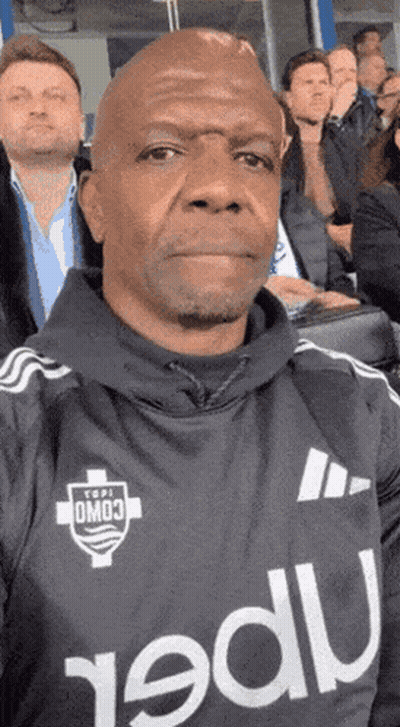 Man Taking Selfie In Stadium Wearing Omo Jersey GIF
