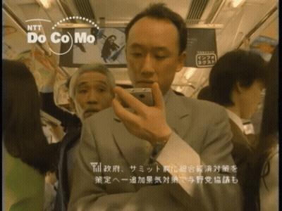 Man Taking Selfie On Bus With NTT Docomo GIF