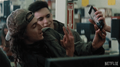 Man Taking Selfie With Another Man In Front Of Fire Alarm GIF