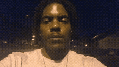 Man Taking Selfie With Eyes Closed In Dark GIF