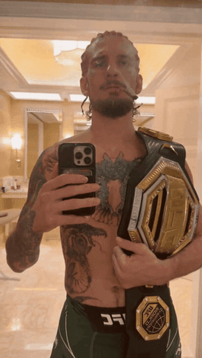 Man Taking Selfie With UFC Belt GIF