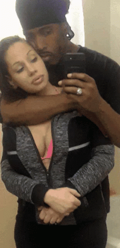 Man Taking Selfie With Woman In Pink Bikini GIF