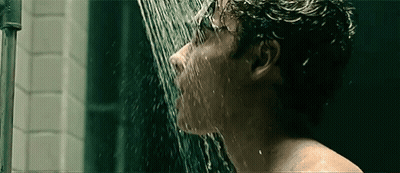 Man Taking Shower With Water Coming Out Of Mouth GIF