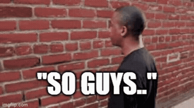 Man Talking By Brick Wall GIF