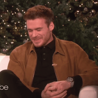 Man Talking In Front Of Christmas Tree GIF